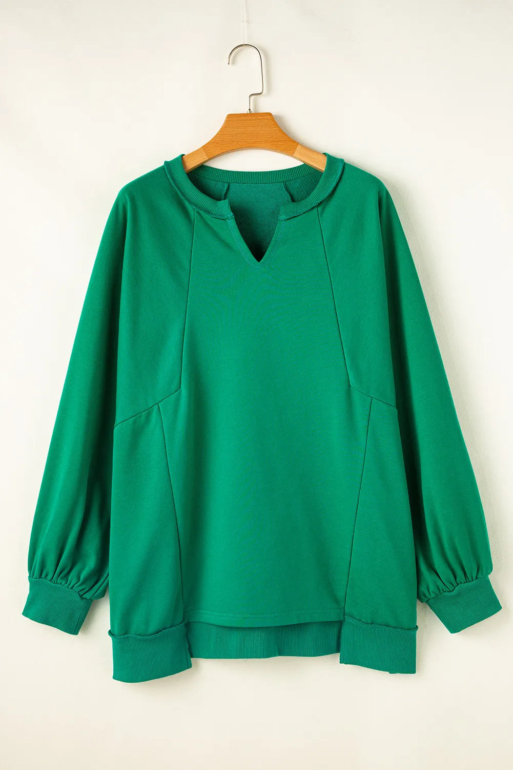 Hadley Cutout Hem Notched Long Sleeve Top