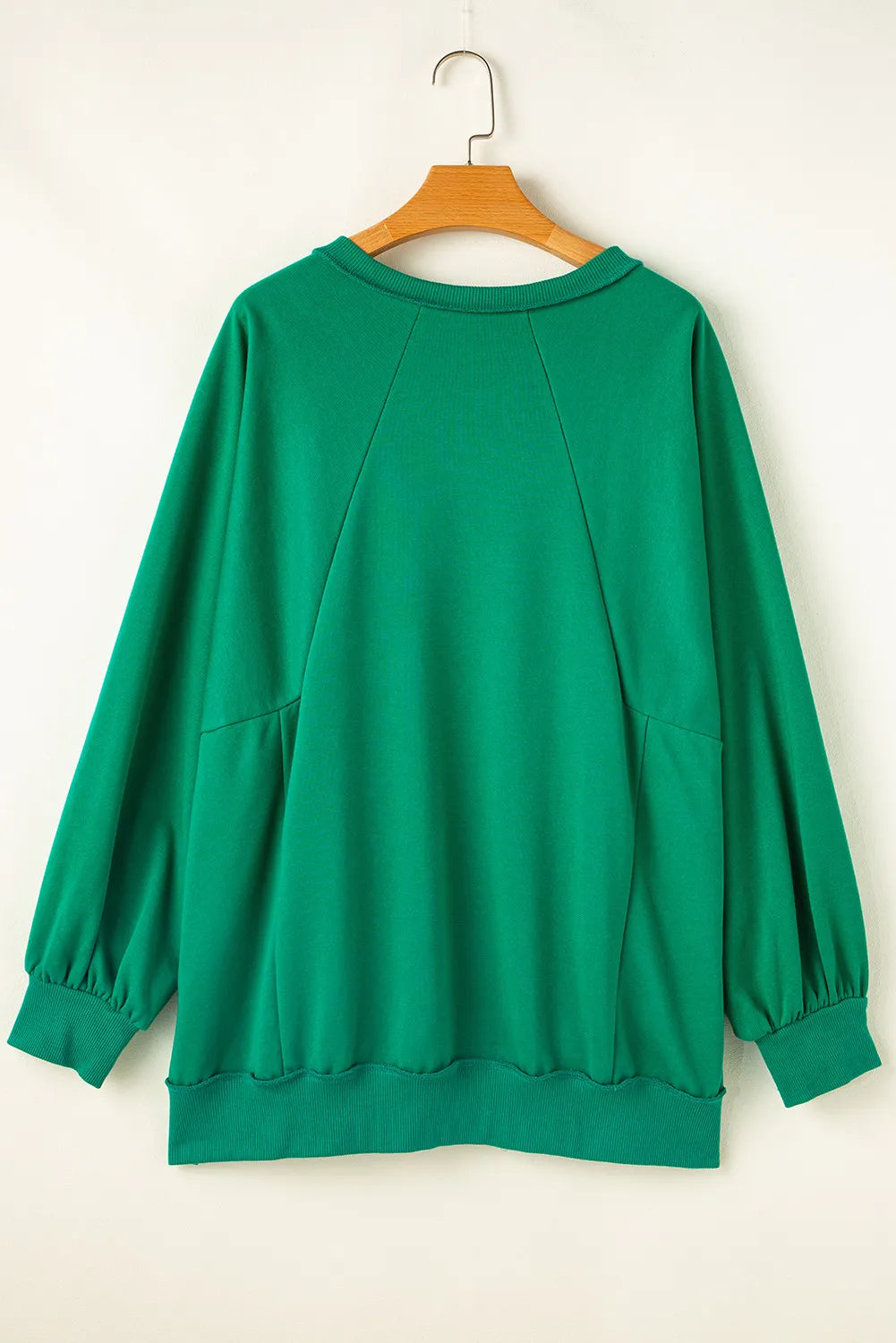 Hadley Cutout Hem Notched Long Sleeve Top